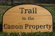 Custom wood sign in cypress for a trail